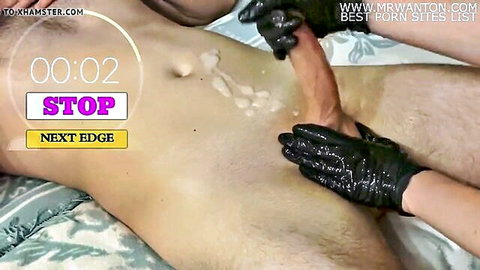 Gloved hands edging male cock in try not to cum challenge with semen spill