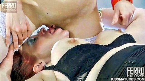 Russian mature Caroline M in black lingerie, blindfolded, lesbian fondling by busty partner