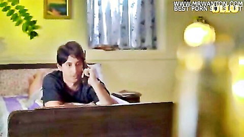Indian man in t-shirt lounging on bed holding cup, teasing hard sex scene