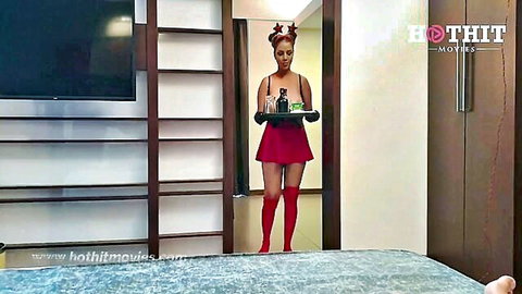 Ebony babe in sexy red elf costume with antlers, cleavage-baring mini dress and stockings