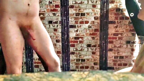 Naked man with red-marked erect penis in BDSM whipping scene