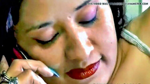 Seductive Indian desi bhabhi on phone call, close-up