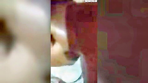 Blurry phone cam captures Bangladeshi couple cuddling intimately with wife in white top