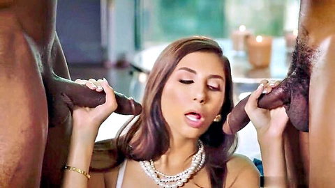 Brunette woman grips two massive black cocks in Blacked interracial scene