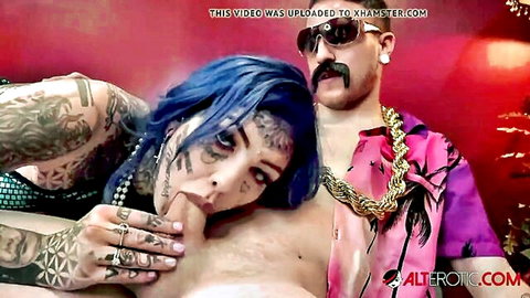 Tattooed Amber Luke in intimate casting couch pose with man, blue hair and pearls