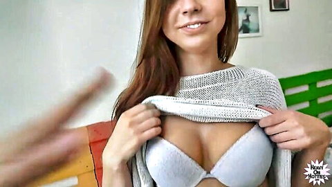 Ornella Morgan teasing cleavage in open white sweater and bra