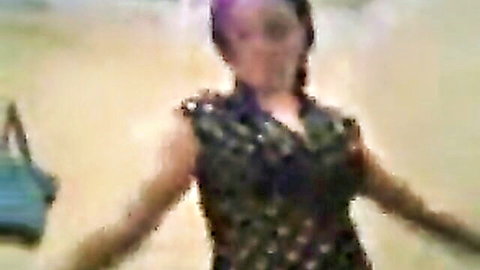 Egyptian beauty in sparkly black top showing deep cleavage