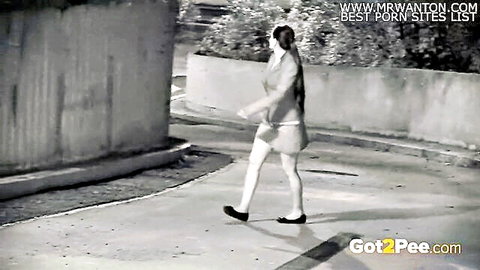 Desperate babe in skirt and stockings walks for night vision piss outdoor