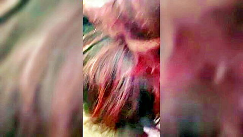 Blurry close-up of redhead giving amateur blowjob to boyfriend