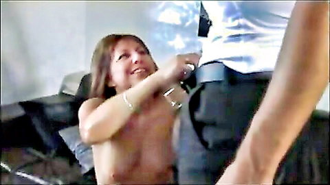 Smiling brunette MILF giving blowjob to clothed man
