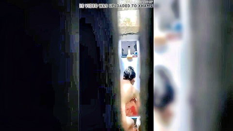 Sexy Indian girl nude shower peeking through door in bathroom