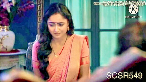 Desi Indian woman in pink saree, emotional expression, sexy traditional attire