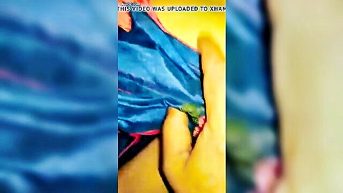 Telugu aunty hand holding blue saree, teasing close-up