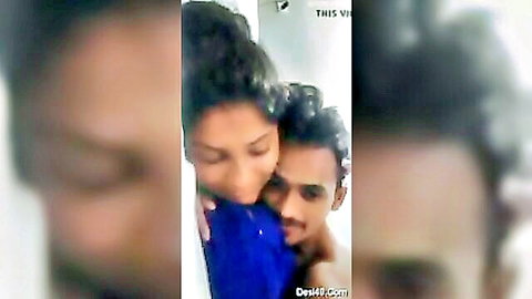 Blurry Indian couple in intimate hug, woman in blue top embracing man