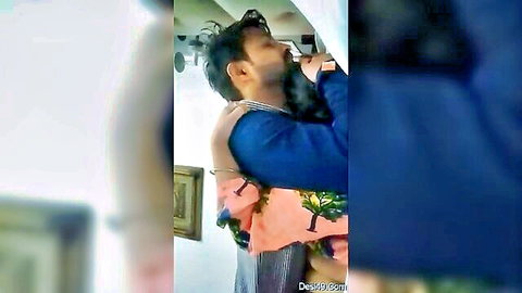 Two bearded Indian men passionately embracing in steamy gay hug