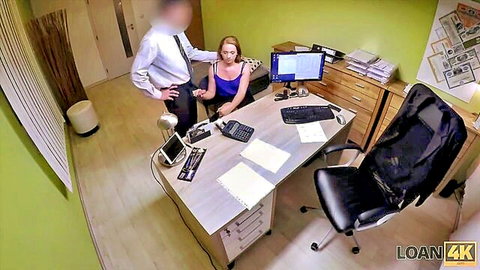 Brunette MILF in low-cut top showing cleavage to suited man in office casting interview