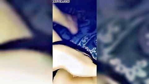 Blurry close-up of white woman in blue lingerie exposing crotch