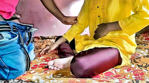 Indian man in yellow kurta intimately gropes stepmom's thighs in pink top and maroon pants on bed