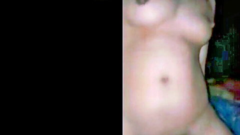 Nude young Thai woman side view exposing perky tit and smooth belly