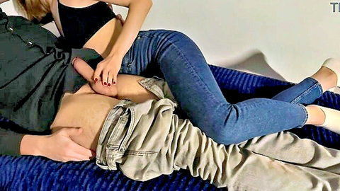 Blonde babe in jeans straddles guy stroking his big hard cock handjob