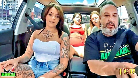 Tattooed Latina babe in tube top and shorts teasing cleavage in car with friends