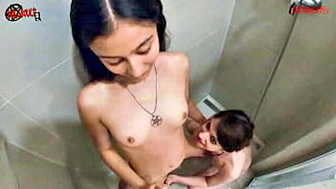 Two nude teen girls in shower, one kneels licking the other's wet pussy closeup