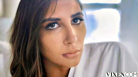 Seductive Avery in white robe, intense gaze for Vixen edging scene