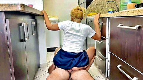 Petite blonde bent over kitchen counter skirt up exposing big ass and wet pussy as man licks her from behind