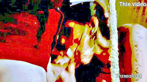 Blurry pixelated abstract colorful image with 'This video' and 'Kumalat' text overlays