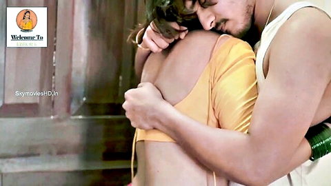 Aabha Paul in yellow saree embraced intimately from behind