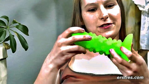 Blonde amateur babe teasing with green textured dildo toy solo