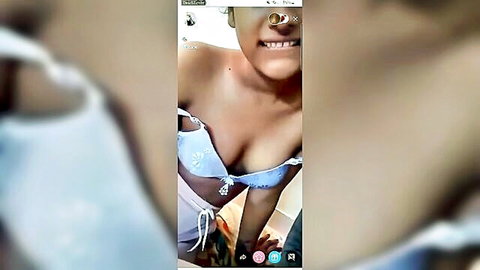 Indian woman in blue lingerie cleavage tease from hot Tango live couple video