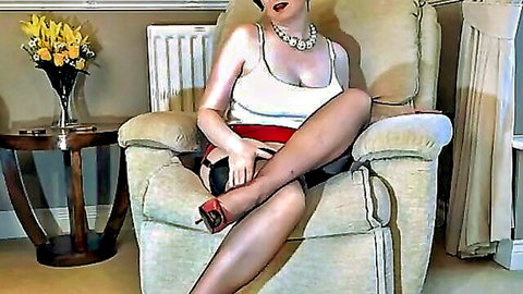 Mature woman teasing in white top, black skirt, stockings and red heels