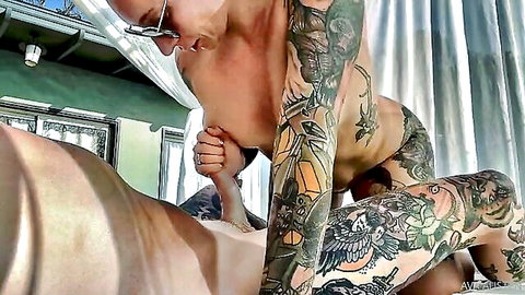 Ava Austen tattooed blonde sucking cock outdoors in sun