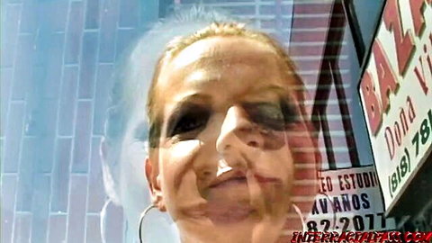 Blonde MILF Sarah Sunn poses seductively outside InterracialPass studio