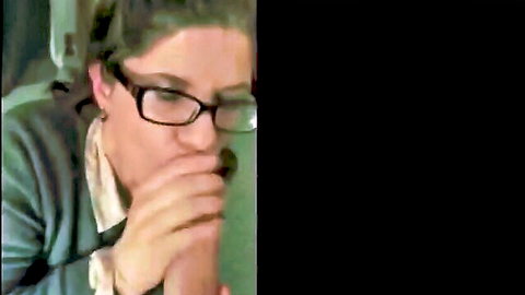 Brunette MILF with glasses giving intense blowjob closeup