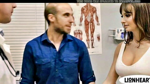 Horny pregnant wife with big tits in low-cut dress with two men in clinic