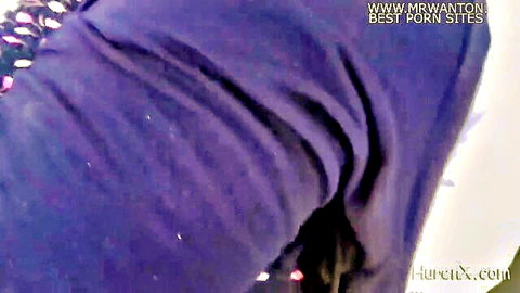 Closeup of wrinkled shiny purple sequined fabric in adult video