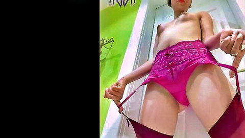 Topless petite with small tits pulls purple garter straps teasing in lingerie stockings