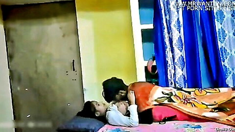 Intimate Desi Indian couple embracing on bed in homemade porn video