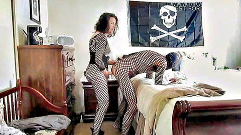 Curly-haired domme in fishnets pegs hooded submissive in strap-on lesbian session