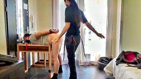 Mistress Andrea Parker pegging bound exhibitionist man