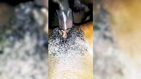 Homemade black anal toy insertion close-up