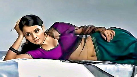 Seductive Indian woman in sheer purple saree lounging teasingly