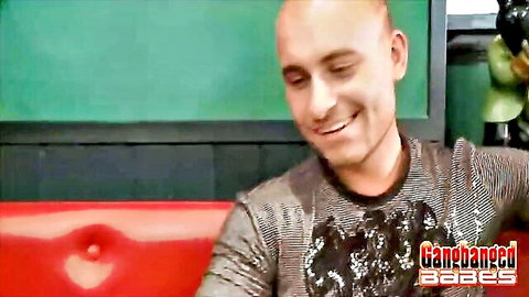 Smiling bald man in gray shirt for Hot Oral Sex Gangbang At The Pub by Gangbanged Babes