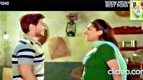 Cute Indian woman with sexy expressions smiling at man in green top