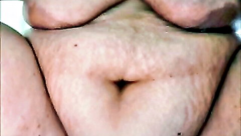 Closeup of BBW woman's hairy spread pussy showing pink inner folds and clit