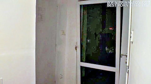 Mysterious nighttime doorway in dimly lit room, adult video preview