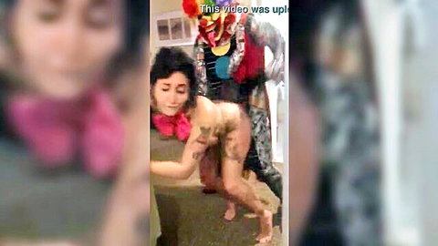Tattooed brunette fucked doggy by clown in amateur scene