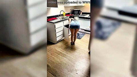 Chubby bubble butt girl bends over in kitchen flashing black thong under tiny denim skirt